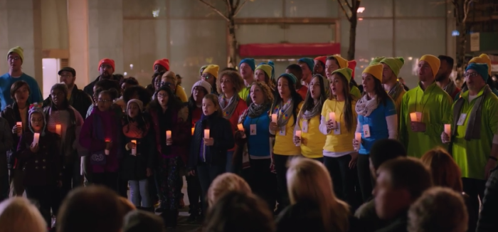A commercial from Microsoft wherein employees and a child choir sing the song 'Let There Be Peace on Earth' to Apple employees, omitting the line 'With God as our Father.'