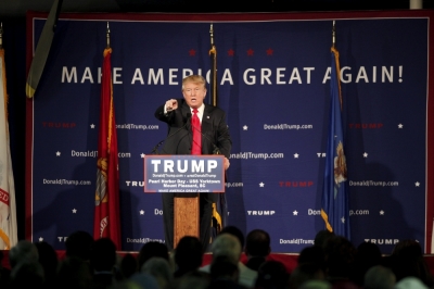 U.S. Republican presidential candidate Donald Trump points to a supporter at a Pearl Harbor Day rally aboard the USS Yorktown Memorial in Mount Pleasant, South Carolina, December 7, 2015. Trump on Monday called for a ban on Muslims entering the United States in the most dramatic response by a candidate yet to last week's shooting spree by two Muslims who the FBI said had been radicalized. 'We have no choice,' Trump said at a rally in South Carolina, warning of more Sept. 11-style attacks if stern measures are not taken.