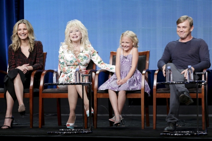 L-R: Cast member Jennifer Nettles, executive producer Dolly Parton, cast members Alyvia Lind, and Ricky Schroder participate in the NBCUniversal 'Dolly Parton's Coat of Many Colors' panel at the Television Critics Association Summer 2015 Press Tour in Beverly Hills, California August 13, 2015.