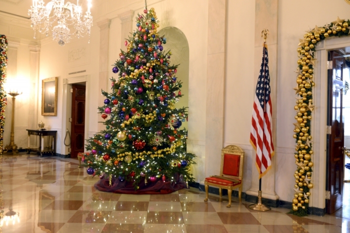 A decorated Christmas tree sits in the Main Foyer of the White House, a preview of holiday decorations being assembled for the season, in Washington, December 2, 2015.
