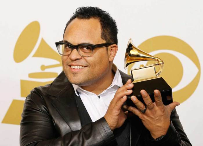 Recording artist Israel Houghton poses with his Grammy after winning Best Pop/Contemporary Gospel Album for 'Love God. Love People' at the 53rd annual Grammy Awards in Los Angeles, California February 13, 2011