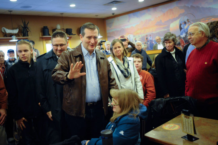 U.S. Republican presidential candidate Ted Cruz arrives at a campaign stop at a Pizza Ranch restaurant in Newton, Iowa November 29, 2015.
