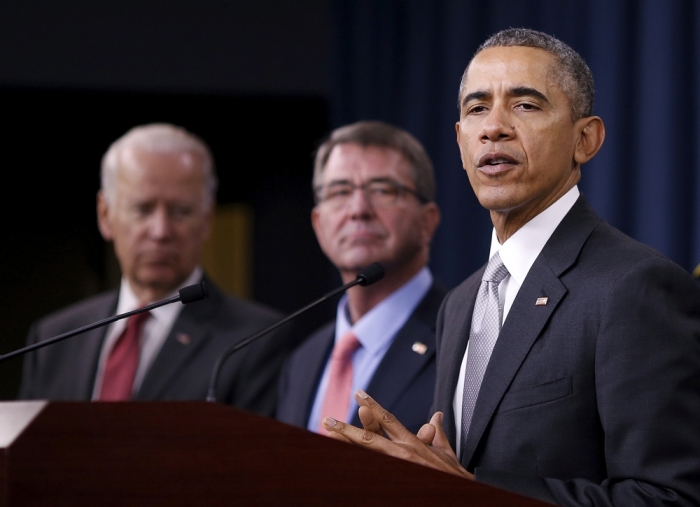 U.S. President Barack Obama delivers remarks after attending a National Security Council meeting on the counter-Islamic State campaign accompanied by U.S. Vice President Joe Biden (L) and U.S. Defense Secretary Ash Carter (C) at the Pentagon in Washington, December 14, 2015.