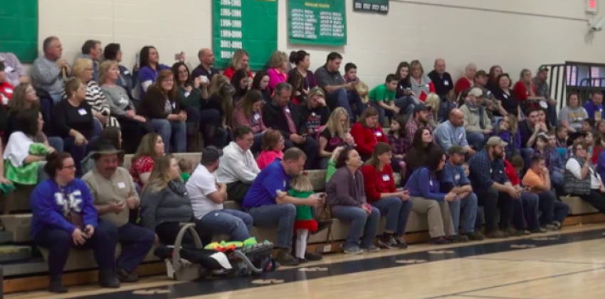 Audience members recite a Bible verse during the production of "A Charlie Brown Christmas" at Johnson County Schools in Kentucky on December 17, 2015.