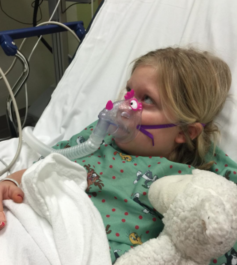 Grace Ana, daughter of singer Natalie Grant, seen in a hospital bed at Swedish Medical Center.