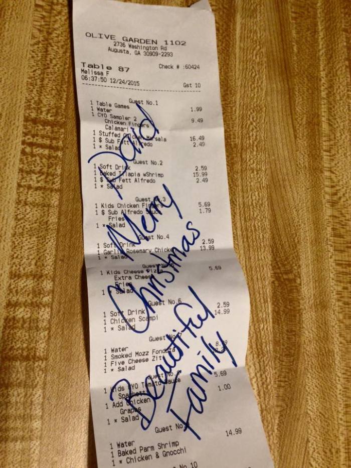 A Muslim man posts a photo of a paid receipt to thank a kind stranger at a Georgia Olive Garden on December 25, 2015.