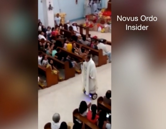 A Filipino priest has been condemned by diocese authorities, after video of him gliding around church on a hoverboard during Christmas Eve mass went viral on December 24, 2015.