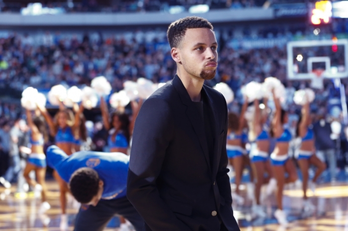 Golden State Warriors injured guard Stephen Curry (30) before the game against the Dallas Mavericks at American Airlines Center, Dallas, Texas, December 30, 2015.