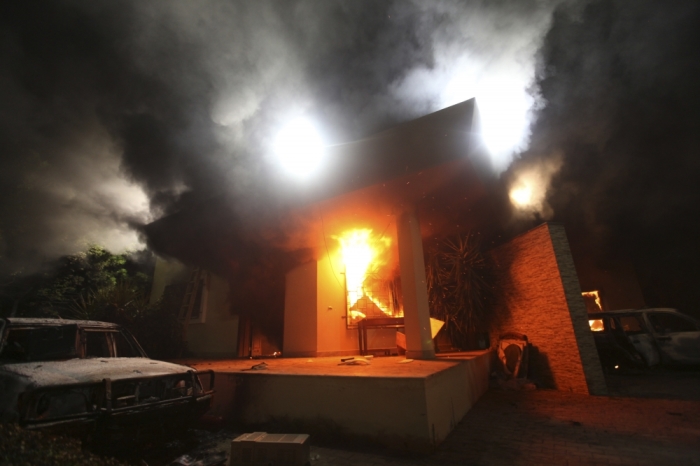 The U.S. Consulate in Benghazi is seen in flames during a protest by an armed group said to have been protesting a film being produced in the United States September 11, 2012. An American staff member of the U.S. consulate in the eastern Libyan city of Benghazi has died following fierce clashes at the compound, Libyan security sources said on Wednesday. Armed gunmen attacked the compound on Tuesday evening, clashing with Libyan security forces before the latter withdrew as they came under heavy fire.