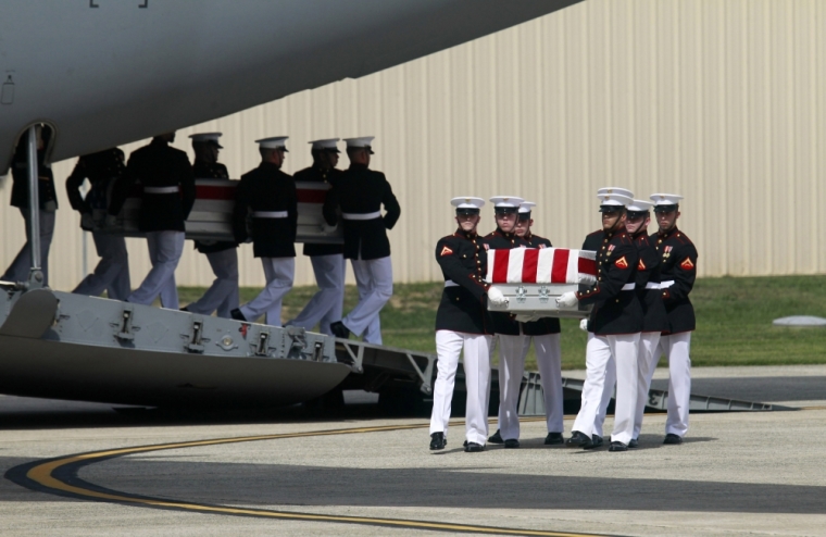 The remains of Americans killed in Benghazi this week are taken off a transport aircraft during a return of remains ceremony at Andrews Air Force Base near Washington, September 14, 2012. President Barack Obama arrived at Andrews Air Force Base on Friday to lead a ceremony honoring the return of the remains of the U.S. ambassador and three other Americans killed in an attack in Libya this week. Ambassador Christopher Stevens and the other Americans died after gunmen attacked the lightly fortified U.S. consulate and a safe house refuge in Benghazi on Tuesday night.