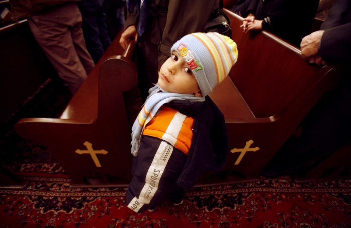 An Iranian Christian boy attends a new year mass at a church in Tehran, January 1, 2007.