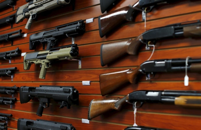 Credit : Shotguns are shown for sale at the AO Sword gun store in El Cajon, California, January 5, 2016. President Barack Obama said on Monday his new executive actions to tighten gun rules were 'well within' his legal authority and consistent with the U.S. right 
