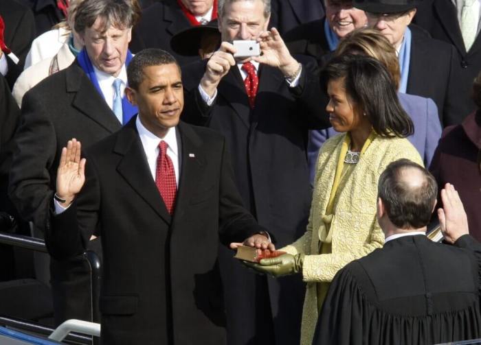 Barack Obama takes the Oath of Office as the 44th president of the United States from U.S. Chief Justice John Roberts (R) as his wife Michelle holds the Bible during the inauguration ceremony in Washington, January 20, 2009.