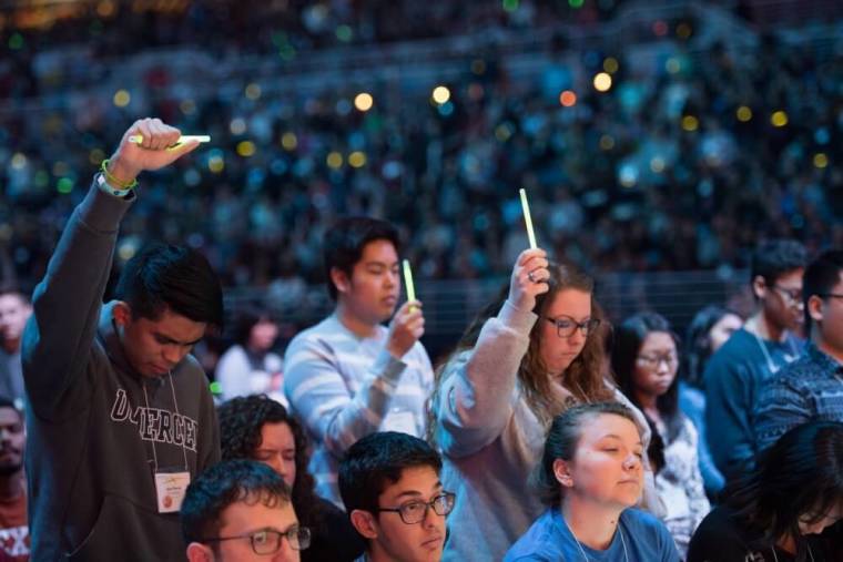 Students respond to the call to commitment at Urbana 15, held in St. Louis, Missouri from December 27-31, 2015. Urbana is the largest student missions conference of its kind in the world, drawing over 16,000 attendees.