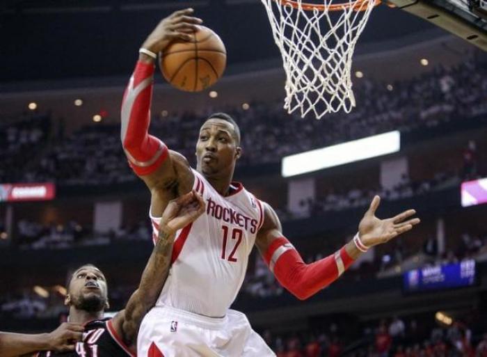 Dwight Howard grabs a rebound against the Portland Blazers during the NBA Playoffs in 2014.