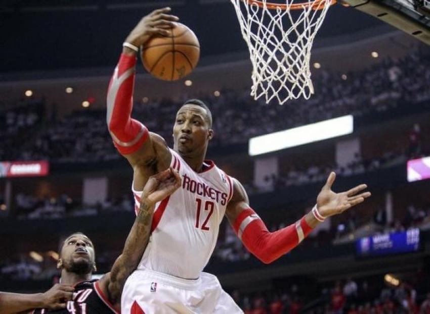 Dwight Howard grabs a rebound against the Portland Blazers during the NBA Playoffs in 2014.