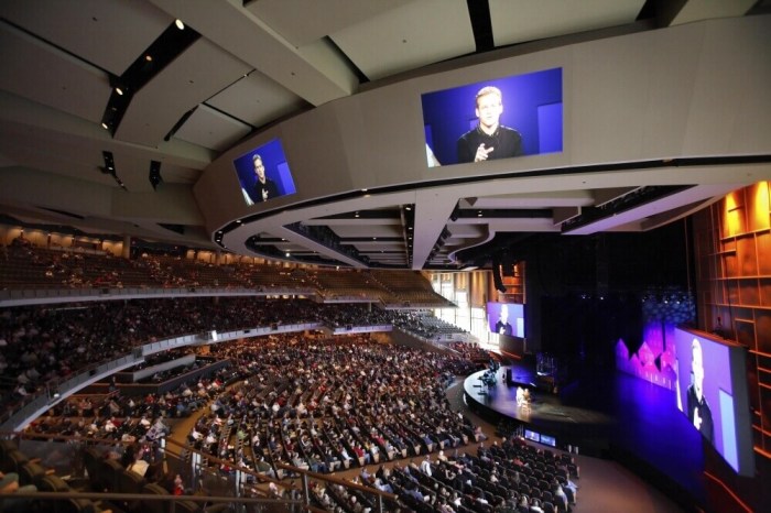 Pastor Gene Appel's image can be seen projected on several televisions in the 7,000-seat Willow Creek Community Church during a Sunday service in South Barrington, Illinois, November 20, 2005.