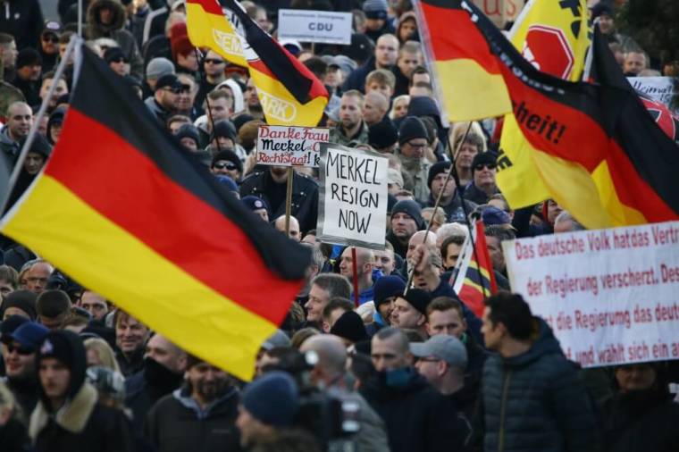 Supporters of anti-immigration right-wing movement PEGIDA (Patriotic Europeans Against the Islamization of the West) take part in in demonstration march, in reaction to mass assaults on women on New Year's Eve, in Cologne, Germany, January 9, 2016.