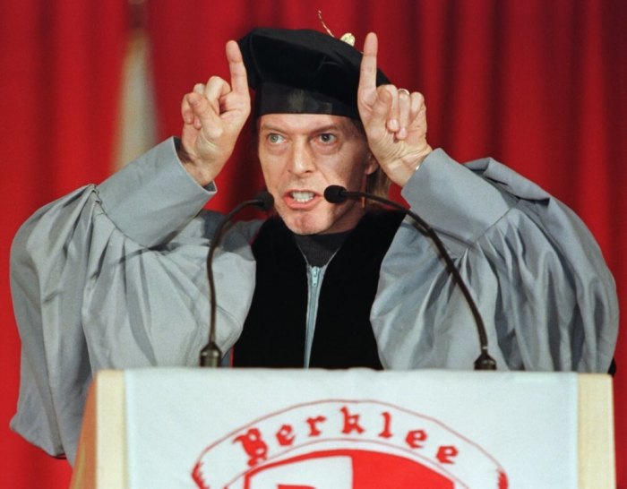 Rock musician David Bowie jokingly makes devils horns in front of his head as he delivers the commencement address May 8 at the 1999 graduation ceremonies of the Berklee College of Music in Boston. Bowie, who joked about the various roles of musicians, spoke to more than 600 graduates about his long friendship with the late British rock star [John Lennon.]