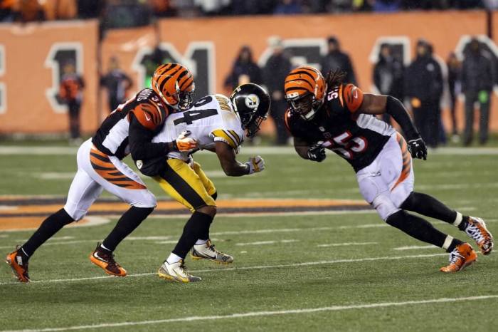 Cincinnati Bengals outside linebacker Vontaze Burfict (55) hits Pittsburgh Steelers wide receiver Antonio Brown (84) during the fourth quarter in the AFC Wild Card playoff football game at Paul Brown Stadium. Burfict was called for a personal foul on the play, Cincinnati, Ohio, January 9, 2016.