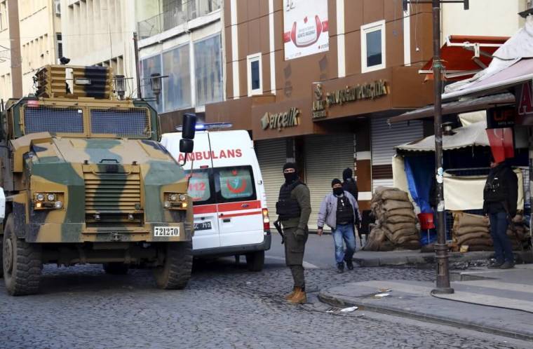 Turkish police stand guard in Sur district, which is partially under curfew, in the Kurdish-dominated southeastern city of Diyarbakir, Turkey, January 12, 2016.