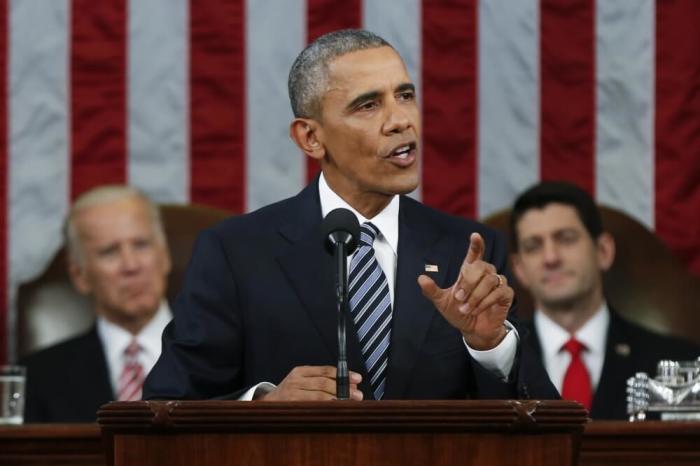 U.S. President Barack Obama delivers his final State of the Union address to a joint session of Congress in Washington January 12, 2016. Vice President Joe Biden (L) and House Speaker Paul Ryan (R-WI) listen from behind the president.