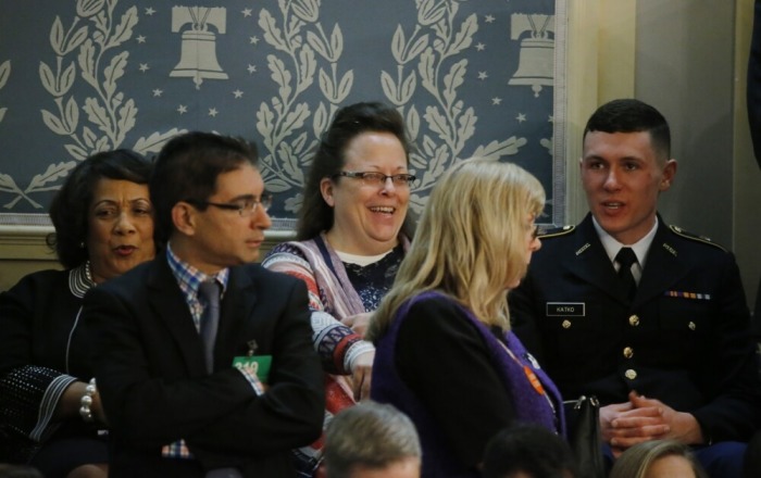 Rowan County Kentucky Clerk Kim Davis (C), who was jailed for five days after refusing to issue marriage licenses to same-sex couples after the U.S. Supreme Court ruled that same sex marriage was legal in June, sits in the House Gallery waiting for the start of U.S. President Barack Obama's State of the Union address to a joint session of Congress in Washington, January 12, 2016.