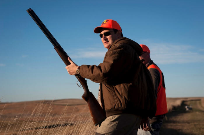 U.S. Republican presidential candidate Sen. Ted Cruz pauses before heading further down field during the Col. Bud Day Pheasant Hunt hosted by Congressman Steve King outside of Akron, Iowa, October 31, 2015.