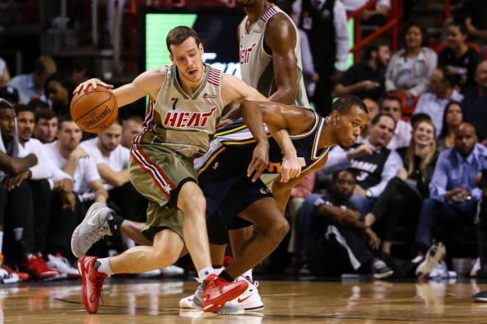 Dragic bumps Utah Jazz defender Rodney Hood in a game at the American Airlines Arena.