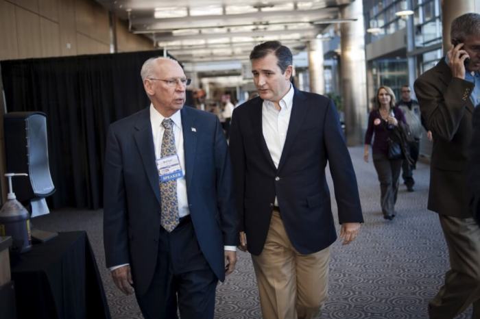 U.S. Republican presidential candidate Texas Sen. Ted Cruz (R) speaks with his father Rafael Cruz at the Freedom 2015 National Religious Liberties Conference in Des Moines, Iowa November 6, 2015.