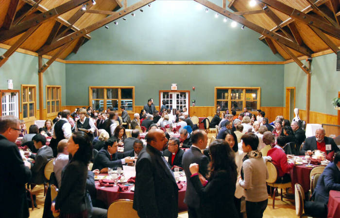 Guests of the inauguration of Evangelical Center in Dover, New York, enjoy dinner together at the dining hall of World Olivet Assembly (formerly Dover Furnace) on Friday, Jan. 15, 2016.