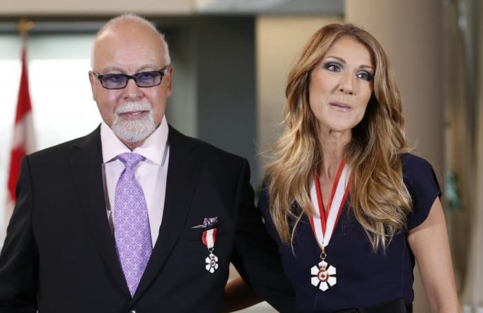 Canadian singer Celine Dion and her husband Rene Angelil pose after receiving the Order of Canada from Canada's Governor General David Johnston at the Citadelle in Quebec City, July 26, 2013.
