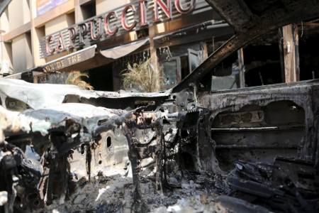 The front of Cappuccino restaurant is seen from a burned-out car after an attack on the restaurant and the Splendid Hotel, in Ouagadougou, Burkina Faso, January 18, 2016.