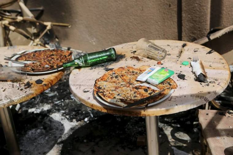 Pizzas are seen on the terrace of Cappuccino restaurant after an attack on the restaurant and the Splendid Hotel in Ouagadougou, Burkina Faso, January 18, 2016.