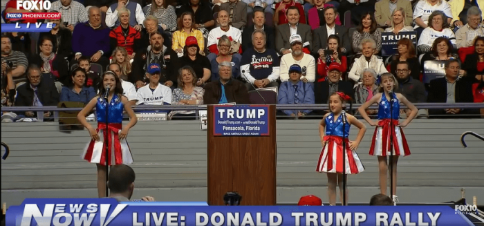 A trio of gals performs a jingoistic song at a recent Donald Trump rally.