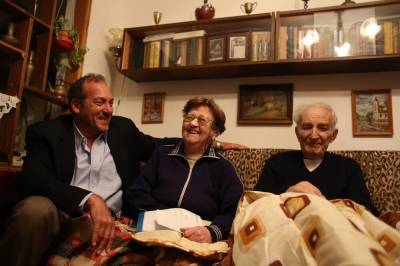 In Israel, Rabbi Yechiel Eckstein (left) meets with Nalya and Lev Slobidker, immigrants from the former Soviet Union and recipients of aid from a food program of the Eckstein-led International Fellowship of Christians and Jews.