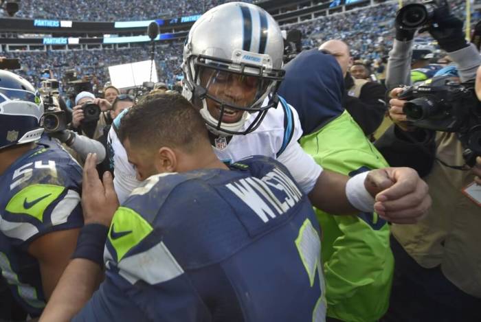 Seattle Seahawks quarterback Russell Wilson (3) congratulates Carolina Panthers quarterback Cam Newton (1) following the NFC Divisional round playoff game at Bank of America Stadium, Charlotte, North Carolina, January 17, 2016. The Panthers defeated the Seahawks 31-24.