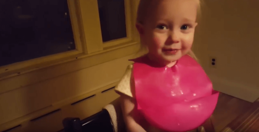 Little girl laughs at the idea of snow.
