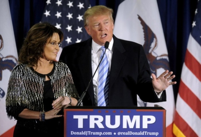 Republican presidential candidate Donald Trump thanks the crowd after receiving former Alaska Gov. Sarah Palin's endorsement at a rally at Iowa State University in Ames on Jan. 19, 2016.