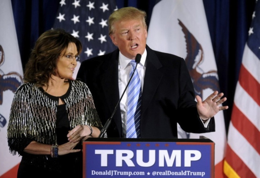 Republican presidential candidate Donald Trump thanks the crowd after receiving former Alaska Gov. Sarah Palin's endorsement at a rally at Iowa State University in Ames on Jan. 19, 2016.