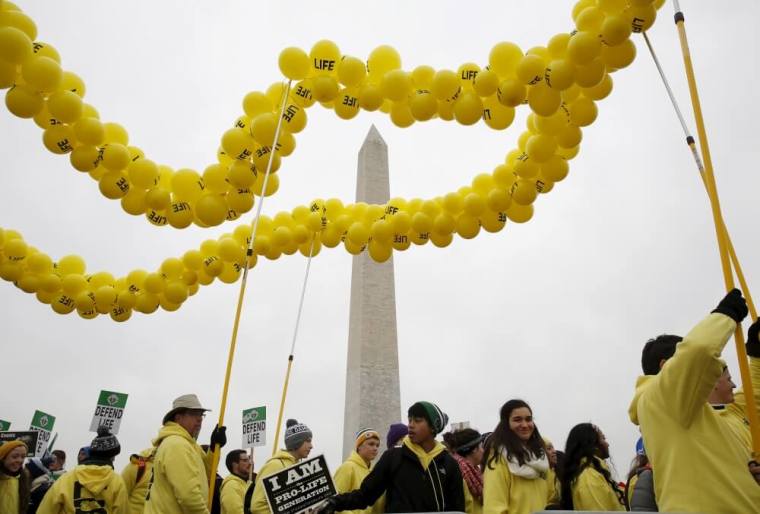 Pro-life supporters gather in front of the Washington Monument before the National March for Life rally in Washington January 22, 2016. The rally marks the 43rd anniversary of the U.S. Supreme Court's 1973 abortion ruling in Roe v. Wade.