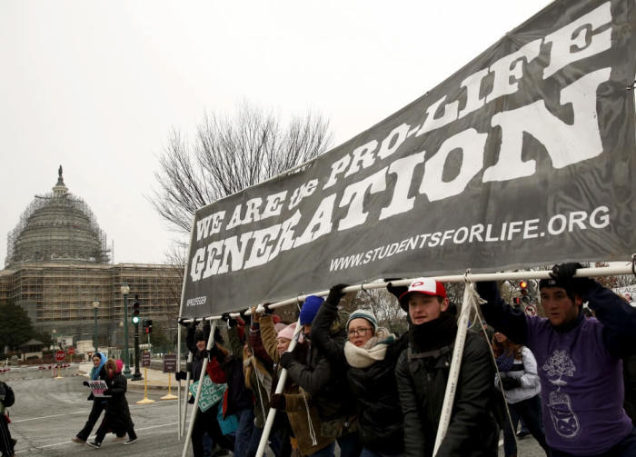 Pro-life supporters pass by the U.S. Capitol en route to the Supreme Court during the National March for Life rally in Washington January 22, 2016. The rally marks the 43rd anniversary of the U.S. Supreme Court's 1973 abortion ruling in Roe v. Wade.