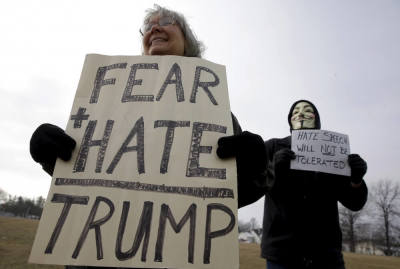 Demonstrators protest outside a U.S. Republican presidential candidate Donald Trump campaign event in Muscatine, Iowa, United States, January 24, 2016.