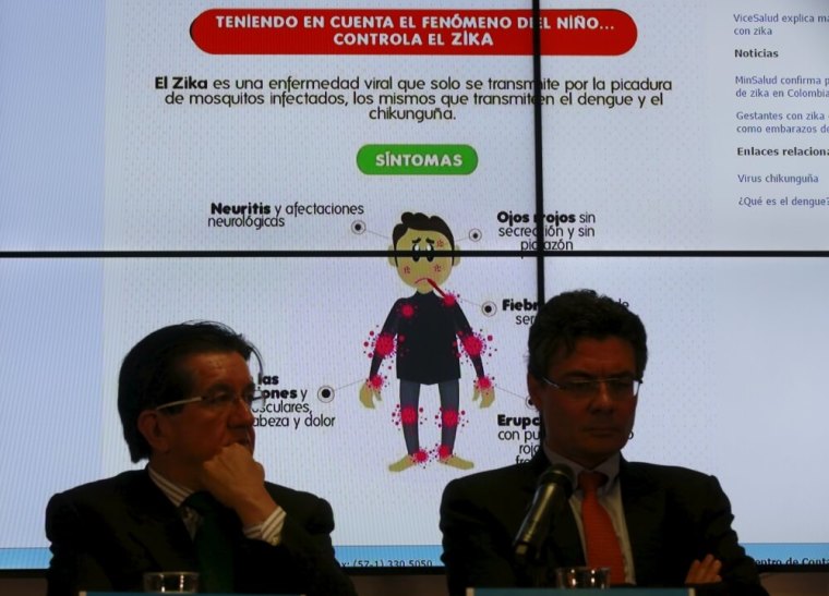 Graph of the symptoms of the Zika virus is seen behind of Colombia's Health Minister Alejandro Gaviria (R) during a news conference on the Zika virus in Bogota, Colombia, January 20, 2016.