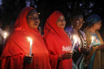 Members of the Bring Back Our Girls movement attend a candlelight procession in tribute to military personnel who were killed in the fight against Boko Haram militants, during Nigeria's Armed Forces Remembrance Day in Abuja, Nigeria, January 15, 2016.