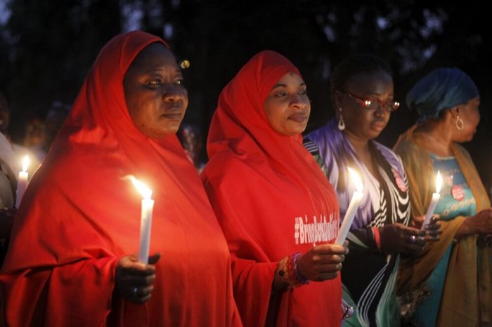 Members of the Bring Back Our Girls movement attend a candlelight procession in tribute to military personnel who were killed in the fight against Boko Haram militants, during Nigeria's Armed Forces Remembrance Day in Abuja, Nigeria, January 15, 2016.