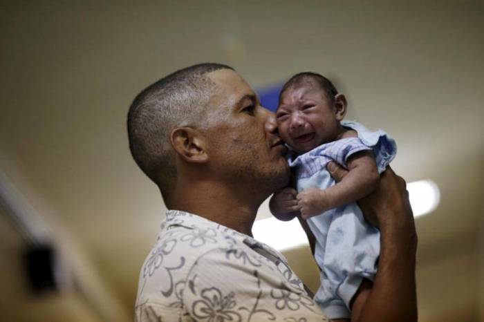 Geovane Silva holds his son Gustavo Henrique, who has microcephaly, at the Oswaldo Cruz Hospital in Recife, Brazil, January 26, 2016.