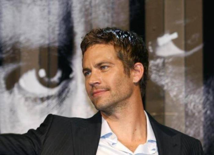 U.S. actor Paul Walker smiles during the premiere of the movie ''Fast and Furious 4'' in Taipei, April 15, 2009.