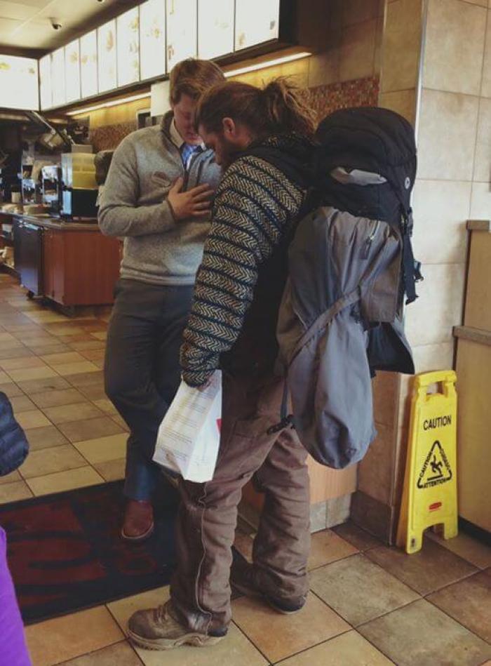 Chick-fil-A customer Joey Mustain captures image of restaurant manager praying with a homeless customer in Murfreesboro, Tennessee, on January 25, 2016.