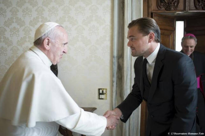Pope Francis shakes hands with actor Leonardo DiCaprio (2nd R) at the Vatican, January 28, 2016.